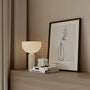 Botanical line art poster displayed in gallery wall with minimalist wall art