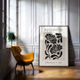 Graphic botanical poster displayed in gallery wall with modern minimalist decor