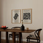 Close up of beige abstract poster set showing organic black shapes and soft tones