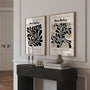 Close up of graphic botanical poster set showing black plant forms and clean lines